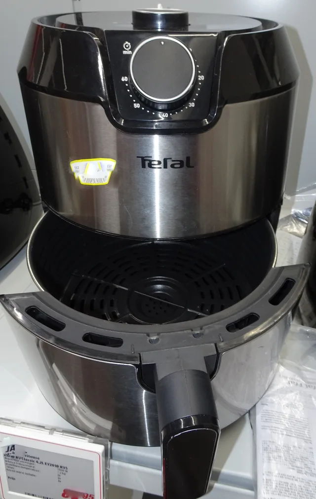 Air fryer with its drawer pulled out, showing the space needed in front of the appliance
