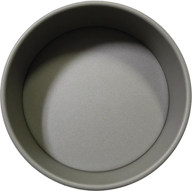Round grey cake tin showing its base, sidewall and rolled rim